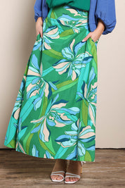 Model Georgiel wearing size 10 of the Rosemary Maxi Skirt – Petalrush in colour Petalrush, in a cropped view