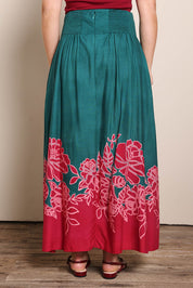 Model Georgiel wearing size 10 of the Rosemary Maxi Skirt – Rosepetal in colour Rosepetal, from the back