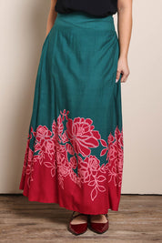 Model Georgiel wearing size 10 of the Rosemary Maxi Skirt – Rosepetal in colour Rosepetal, in a cropped view