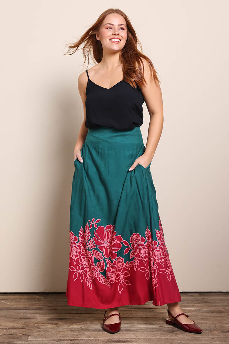 Model Georgiel wearing size 10 of the Rosemary Maxi Skirt – Rosepetal in colour Rosepetal, from the front