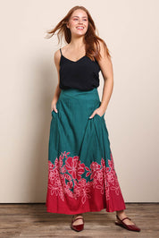 Model Georgiel wearing size 10 of the Rosemary Maxi Skirt – Rosepetal in colour Rosepetal, from the front