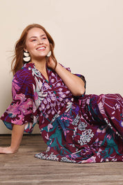 Model Georgiel wearing size 10 of the Katherine Cotton Tired Dress – Garden in colour Garden, from an angle
