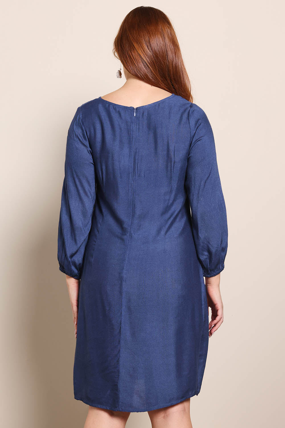 Model Georgiel wearing size 10 of the Isabella Shift Dress – Foxglove in colour Foxglove, from the back