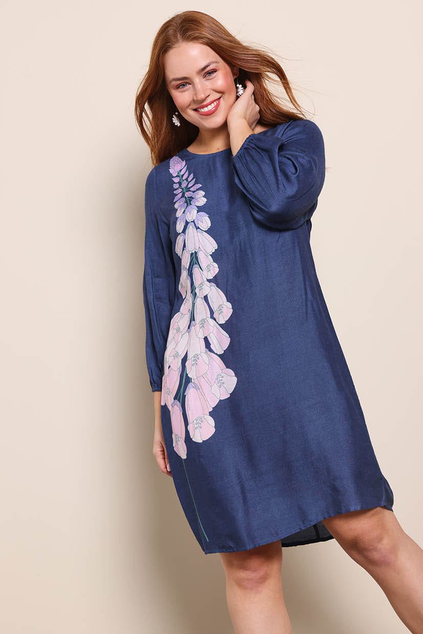 Model Georgiel wearing size 10 of the Isabella Shift Dress – Foxglove in colour Foxglove, in a cropped view