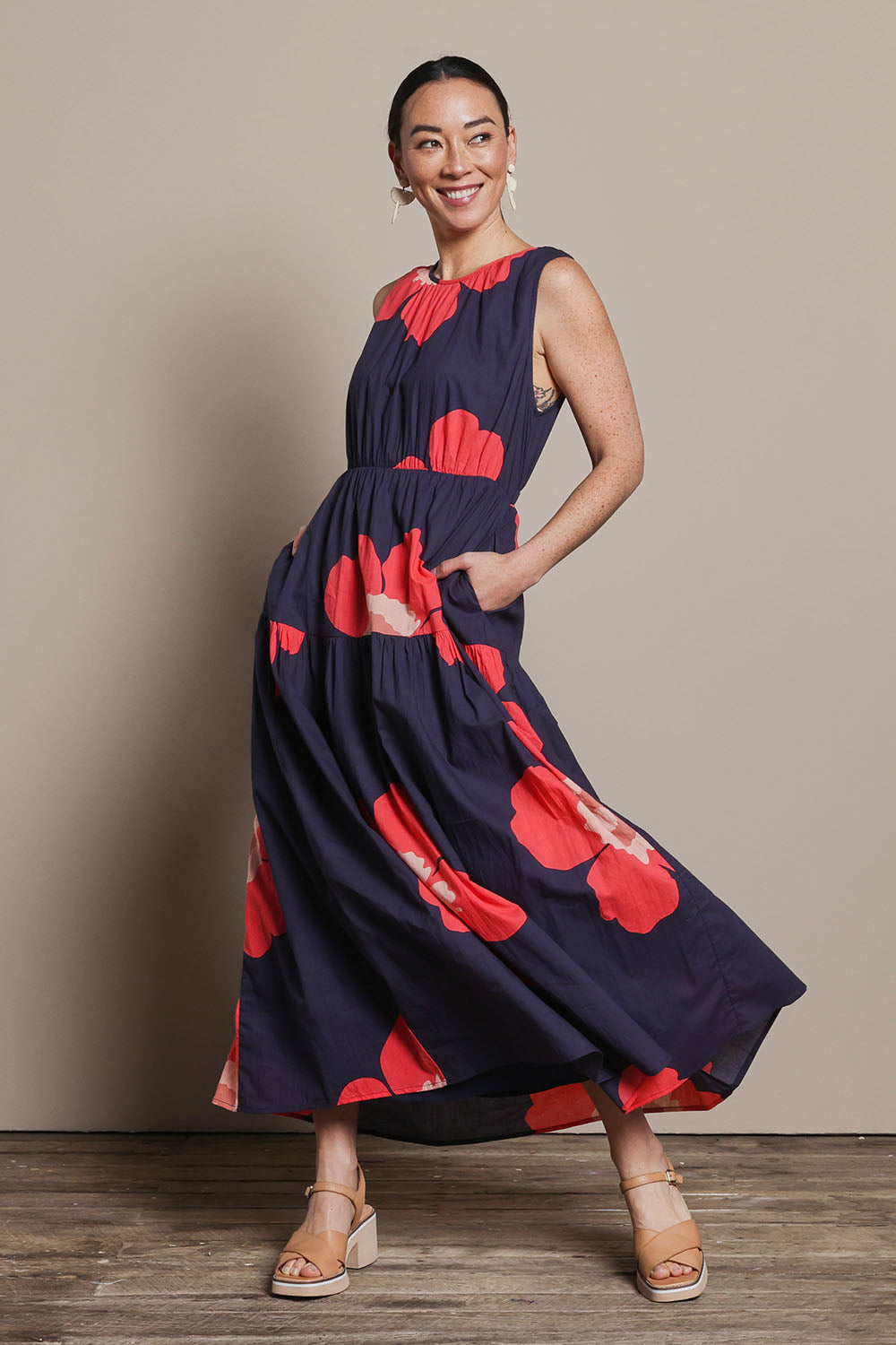 Model Katie wearing size 10 of the Riley Cotton Maxi Dress in colour Boldflower (Blue), from the front, showing the whole outfit
