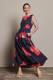 Model Katie wearing size 10 of the Riley Cotton Maxi Dress in colour Boldflower (Blue), from the front, showing the whole outfit