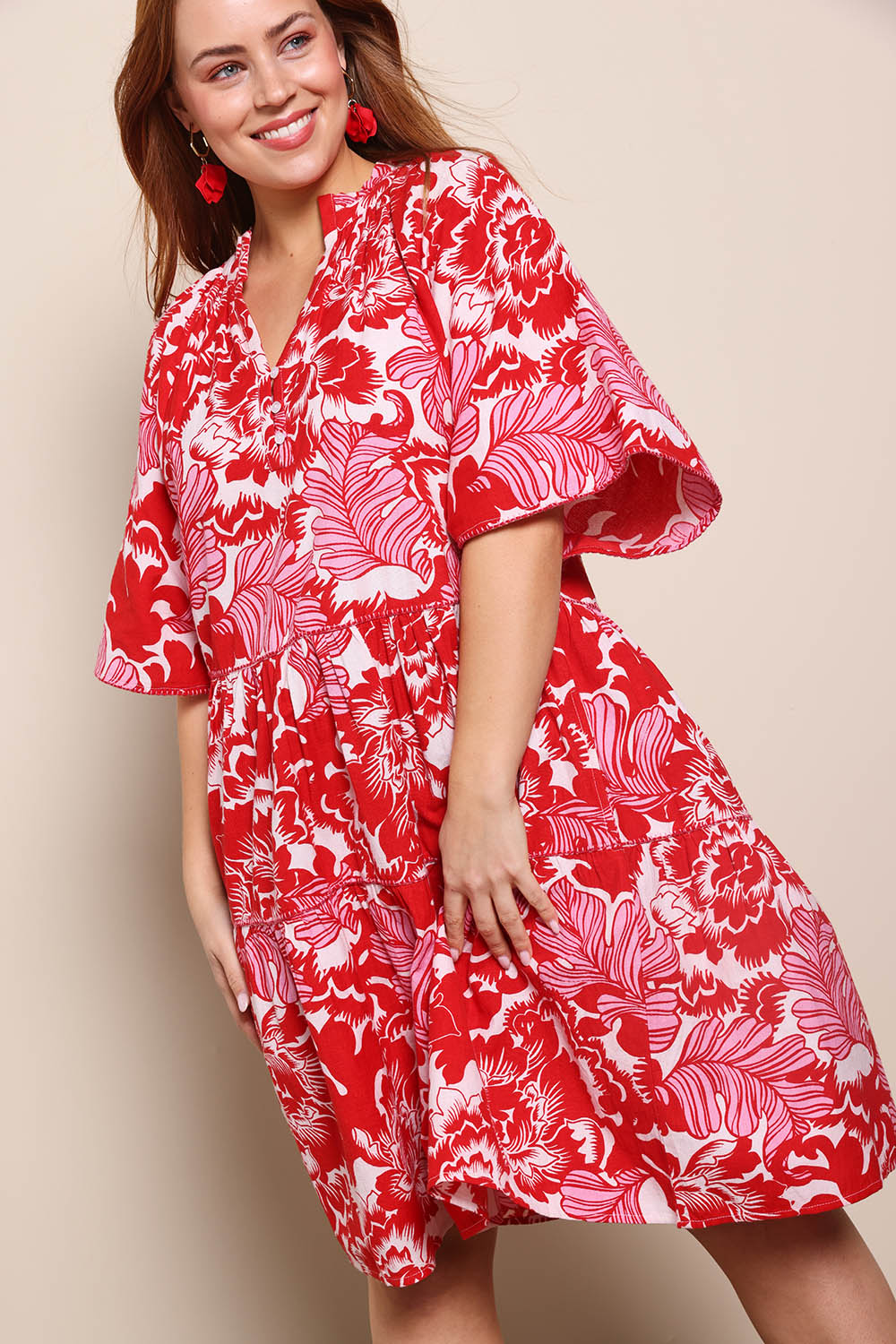 Model Georgiel wearing size 10 of the Kathy Cotton Dress – Bloomlet in colour Bloomlet, from an angle