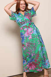 Model Georgiel wearing size 10 of the Lilly Cotton Wrap Dress – Greengard in colour Greengard, from the front