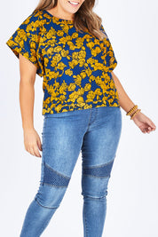 Model Natalia wearing size 14 of the Lola Bell Sleeve Top Entangled Vines in colour Gold, from the front, cropped image