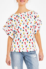 Model Courtney wearing size 10 of the Lola Belle Sleeve Top in colour Speckled (White), from the front, cropped image