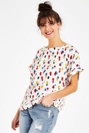 Model Courtney wearing size 10 of the Lola Belle Sleeve Top in colour Speckled (White), from the front, cropped image
