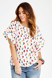 Model Laura wearing size 14 of the Lola Belle Sleeve Top in colour Speckled (White), from the front, cropped image