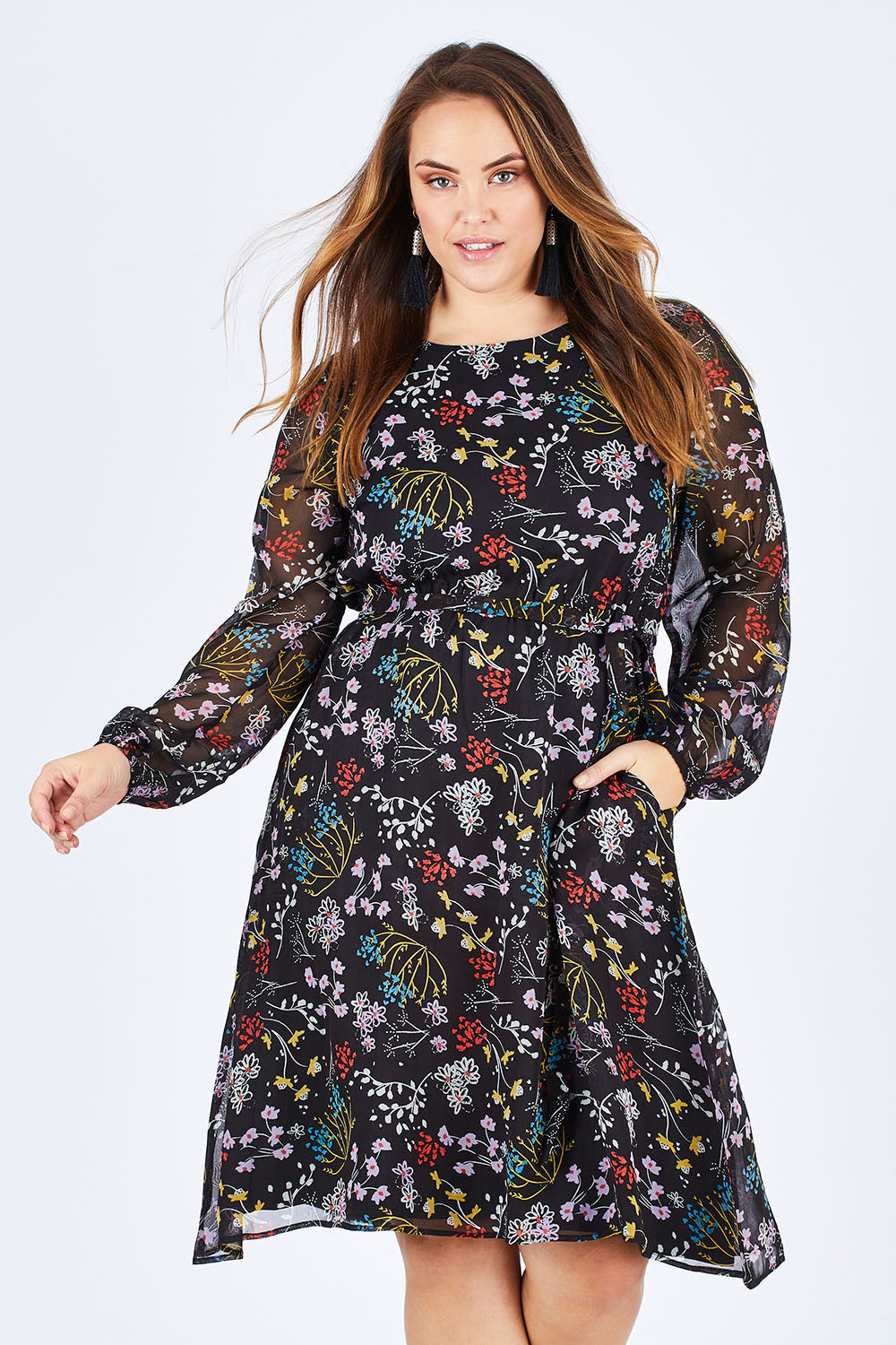 Model Sophie wearing size 14 of the Odette Dress Garden Dweller in colour Black (Black), from the front, cropped image