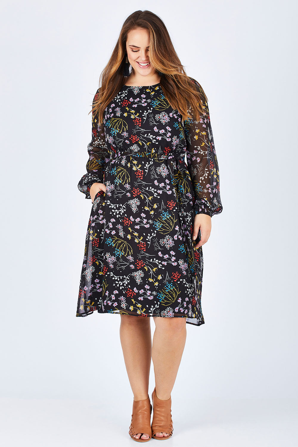 Model Sophie wearing size 14 of the Odette Dress Garden Dweller in colour Black (Black), from the front, showing the whole outfit