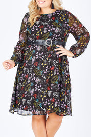 Model Sophie wearing size 18 of the Odette Dress Garden Dweller in colour Black (Black), from the front, cropped image