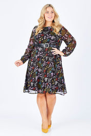 Model Sophie wearing size 18 of the Odette Dress Garden Dweller in colour Black (Black), from the front, showing the whole outfit
