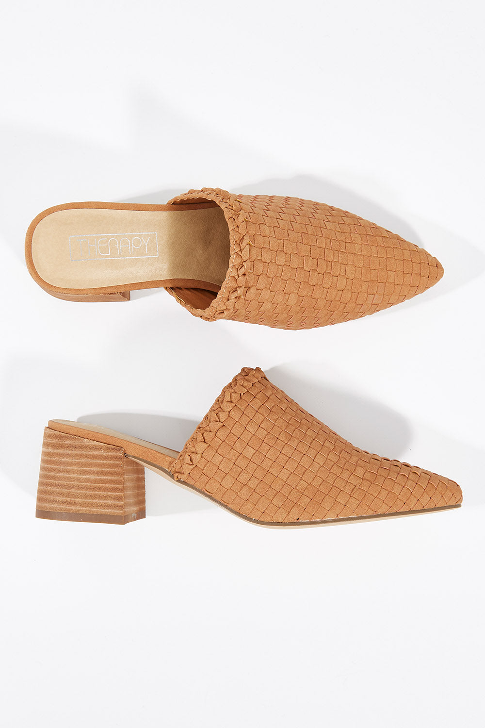 A model wearing size 7 of the Azure Mule Heel in colour Tan, from the front, showing the whole outfit
