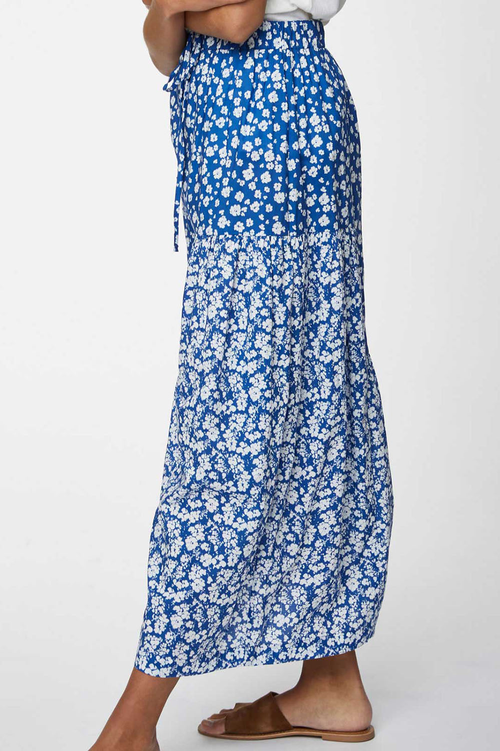 A model wearing the Verronica Organic Cotton Skirt in colour Marine (Blue), from the front, cropped image