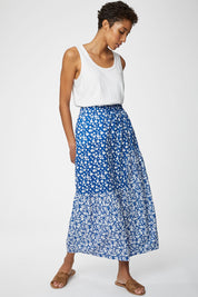 A model wearing the Verronica Organic Cotton Skirt in colour Marine (Blue), from the front, showing the whole outfit