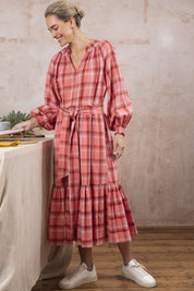 A model wearing the Iman Hemp Check Midi Dress in colour Lightcoral (Pink), from the front, showing the whole outfit