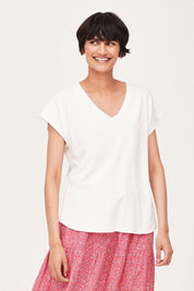 A model wearing The Easy Hemp Vin colourNeck Top - White (White), from the front, cropped image