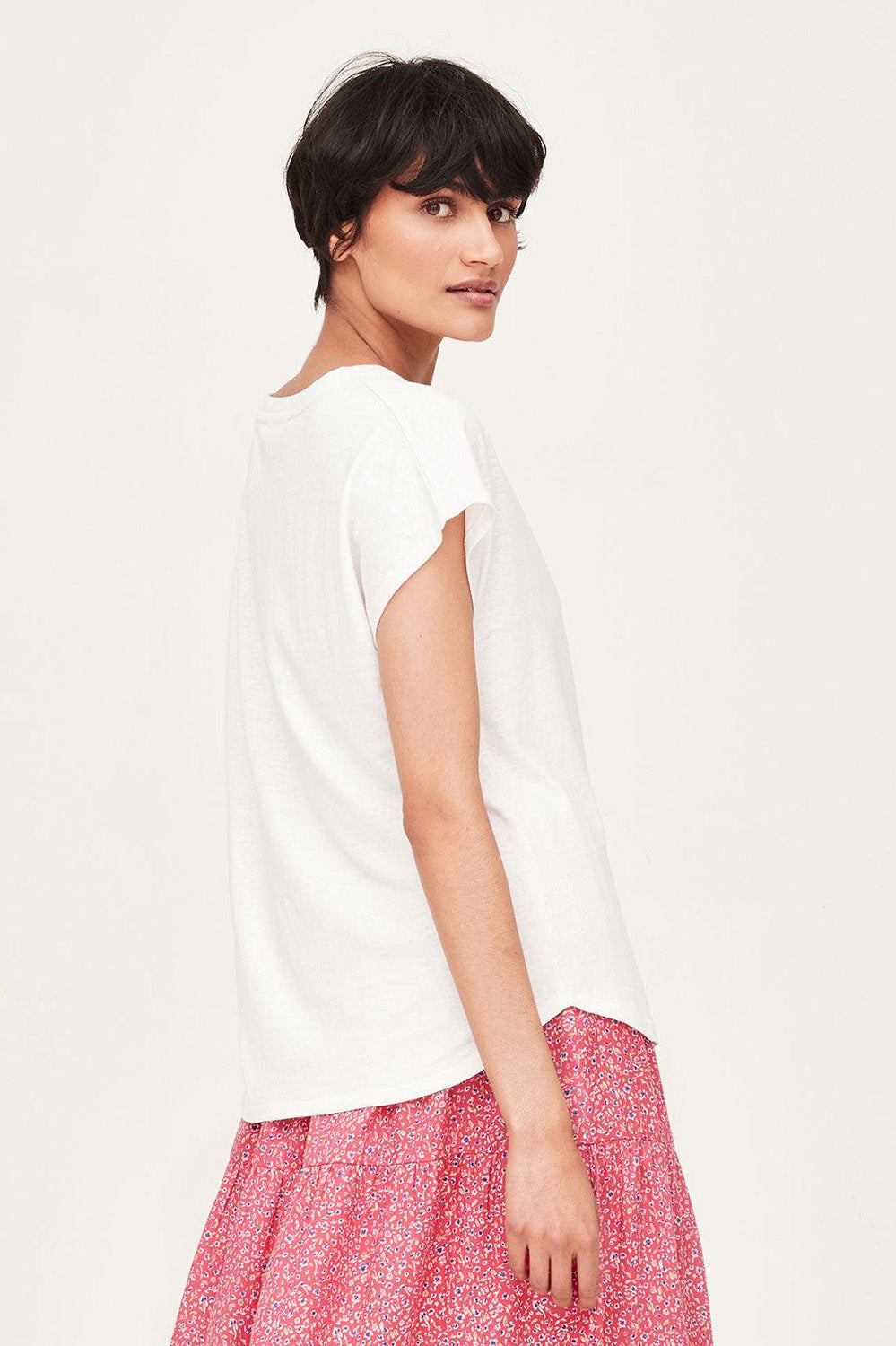 A model wearing The Easy Hemp Vin colourNeck Top - White (White), from the front, cropped image
