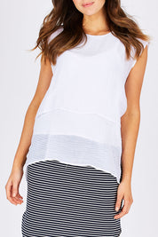 Model Madeline wearing size S of the Layered Top in colour White (White), from the front, cropped image