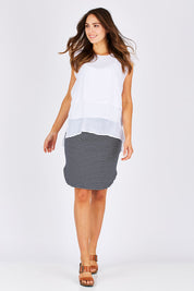 Model Madeline wearing size S of the Layered Top in colour White (White), from the front, showing the whole outfit