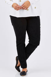 Model Mae wearing size XXL of the Sally Textured Pant in colour Black (Black), from the front, cropped image