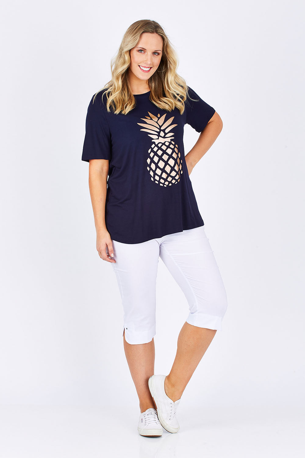 Model Jess wearing size L of the Trimmed Pocket Cropped Pant in colour White (White), from the front, showing the whole outfit