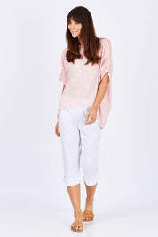 Model Monique wearing size S of the Trimmed Pocket Cropped Pant in colour White (White), from the front, showing the whole outfit