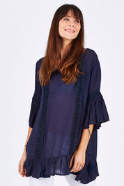 Model Monique wearing size S of the Lace Trim Kaftan in colour Navy (Blue), from the front, cropped image