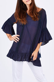 Model Monique wearing size S of the Lace Trim Kaftan in colour Navy (Blue), from the front, cropped image