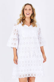 Model Jess wearing size L of the Lace Dress in colour White (White), from the front, cropped image
