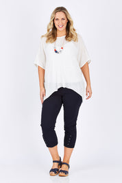 Model Jess wearing size L of the Eyelet Trim Pant in colour Navy (Blue), from the front, showing the whole outfit
