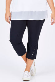 Model Mae wearing size XXL of the Eyelet Trim Pant in colour Navy (Blue), from the front, cropped image