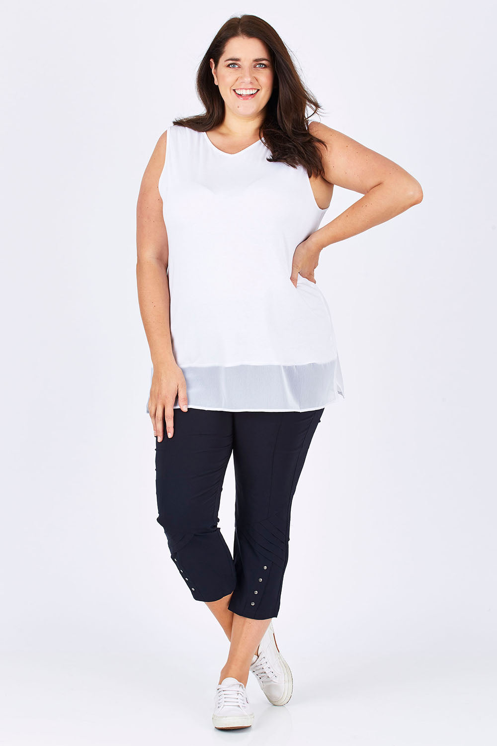 Model Mae wearing size XXL of the Eyelet Trim Pant in colour Navy (Blue), from the front, showing the whole outfit