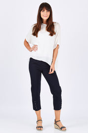 Model Monique wearing size S of the Eyelet Trim Pant in colour Navy (Blue), from the front, showing the whole outfit