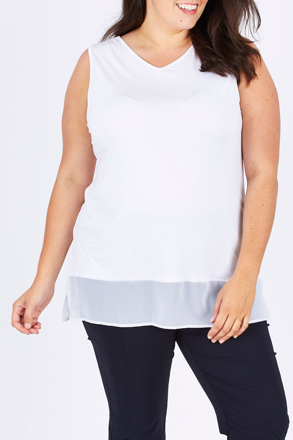 Model Mae wearing size XXL of the Reversible Scoop/v Neck Tank in colour White (White), from the front, cropped image