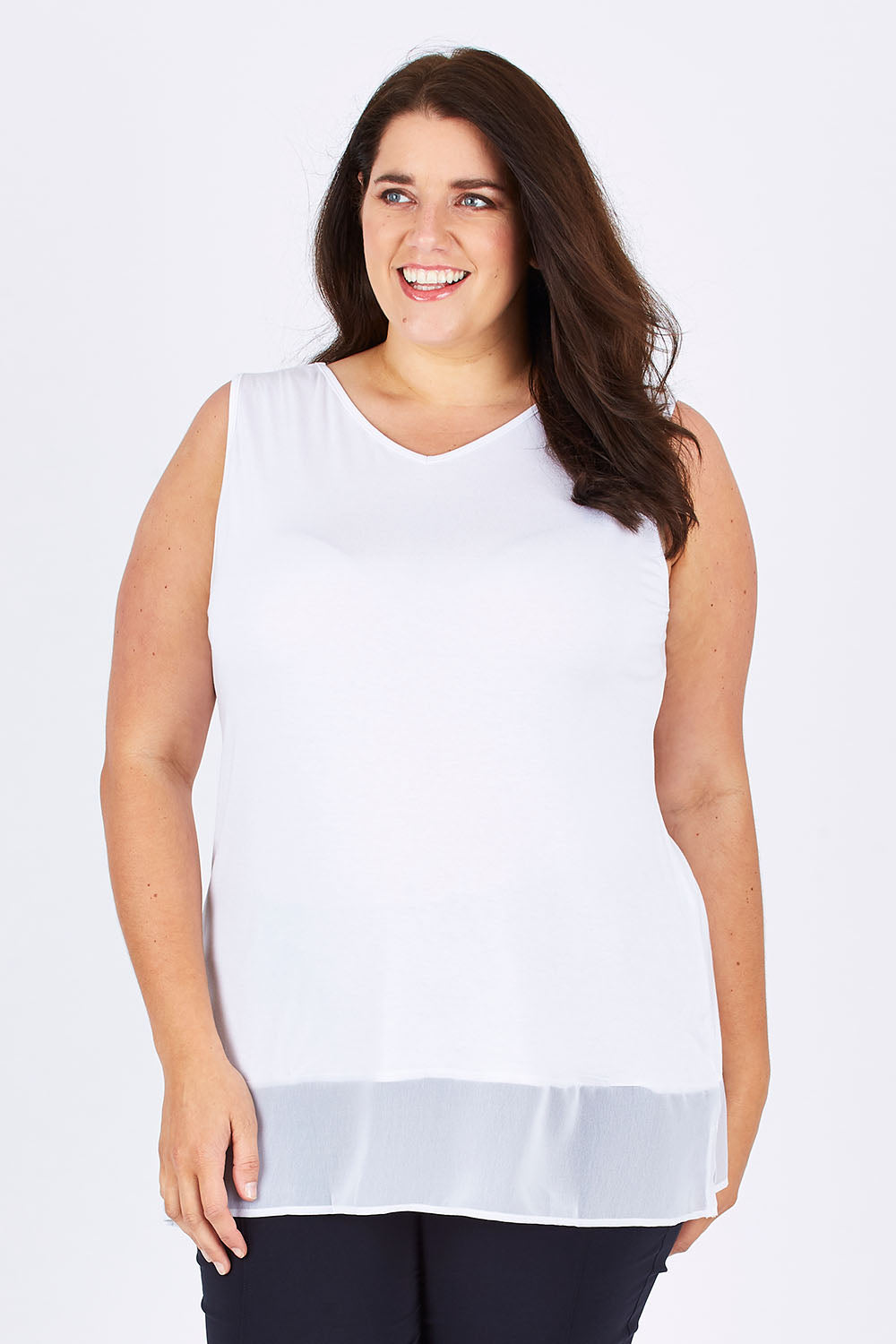 Model Mae wearing size XXL of the Reversible Scoop/v Neck Tank in colour White (White), from the front, cropped image