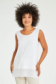 Model Olivia wearing size S of the Reversible Scoop/v Neck Tank in colour White (White), from the front, cropped image