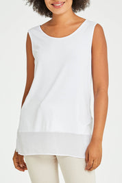 Model Olivia wearing size S of the Reversible Scoop/v Neck Tank in colour White (White), from the front, cropped image