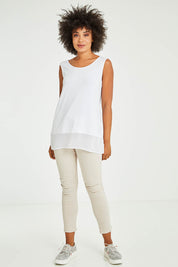 Model Olivia wearing size S of the Reversible Scoop/v Neck Tank in colour White (White), from the front, showing the whole outfit
