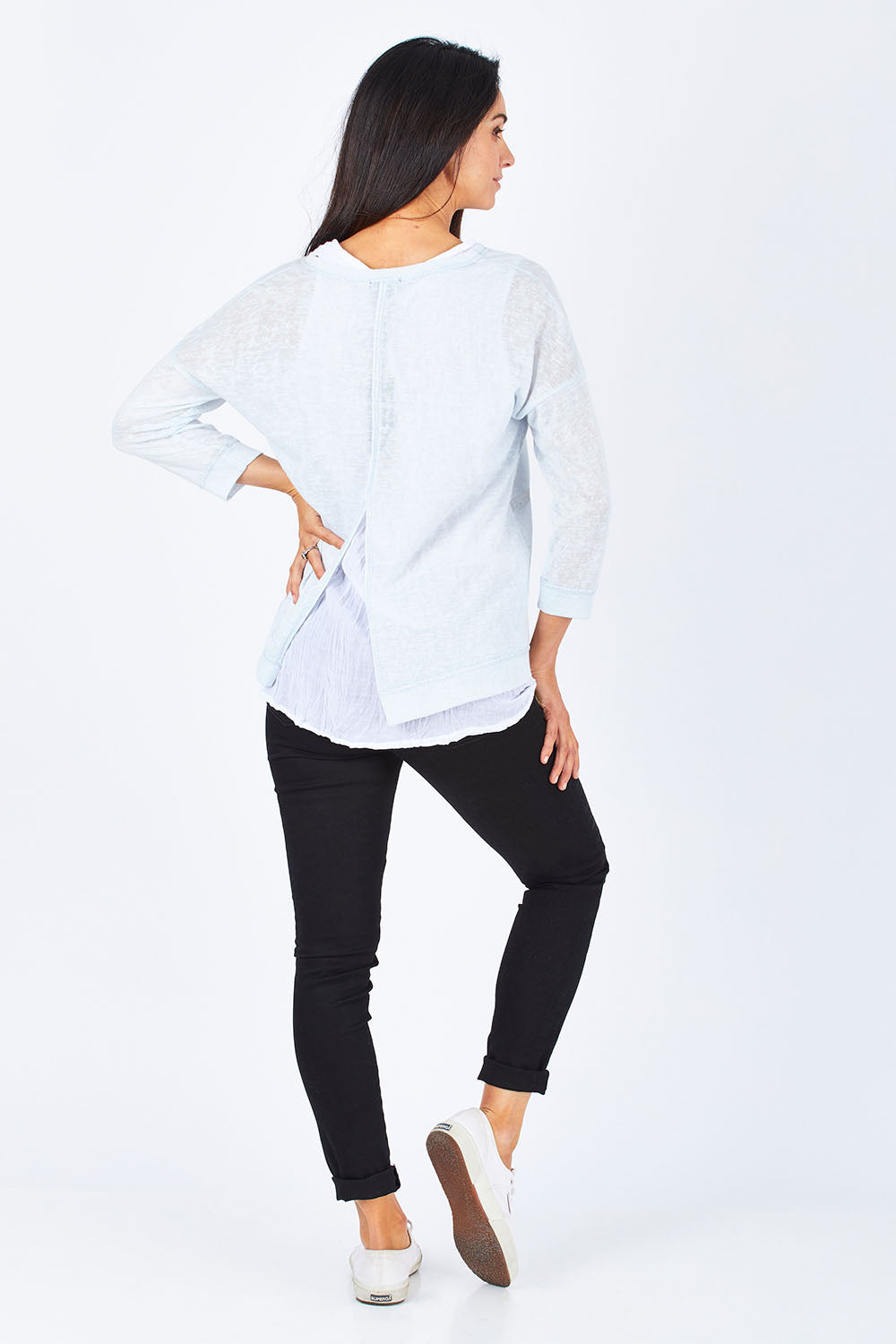 Model Gemma wearing size S of the Foil Striped 2 In 1 Top in colour Blue (Blue), from the back