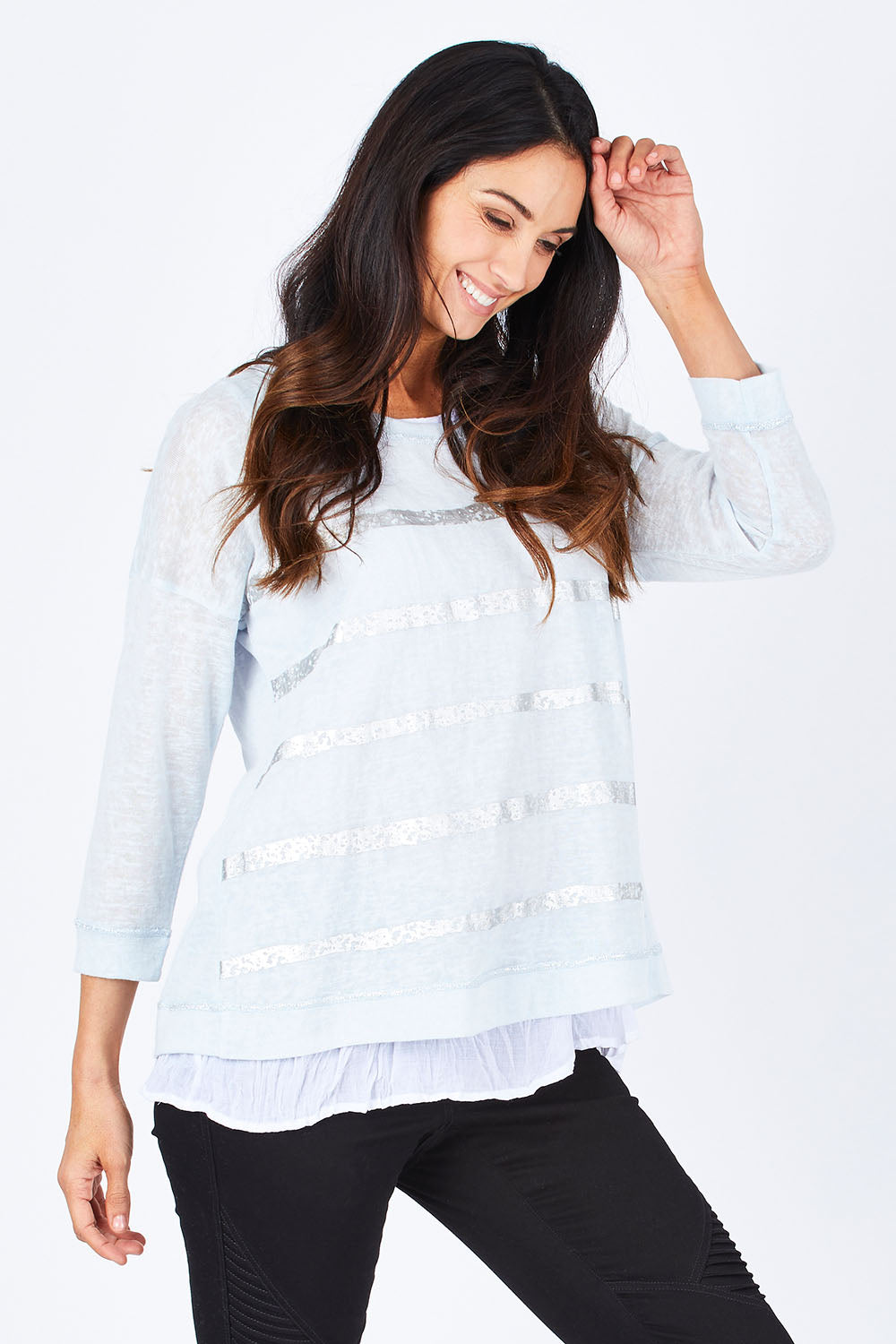 Model Gemma wearing size S of the Foil Striped 2 In 1 Top in colour Blue (Blue), from the front, cropped image