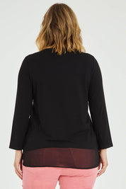 Model Jess wearing size L of the L/S Georgette Hem Top in colour Black (Black), from the back