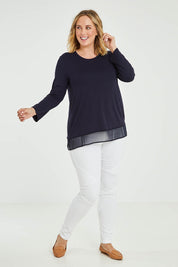 Model Jess wearing size L of the L/S Georgette Hem Top in colour Navy (Blue), from the front, showing the whole outfit