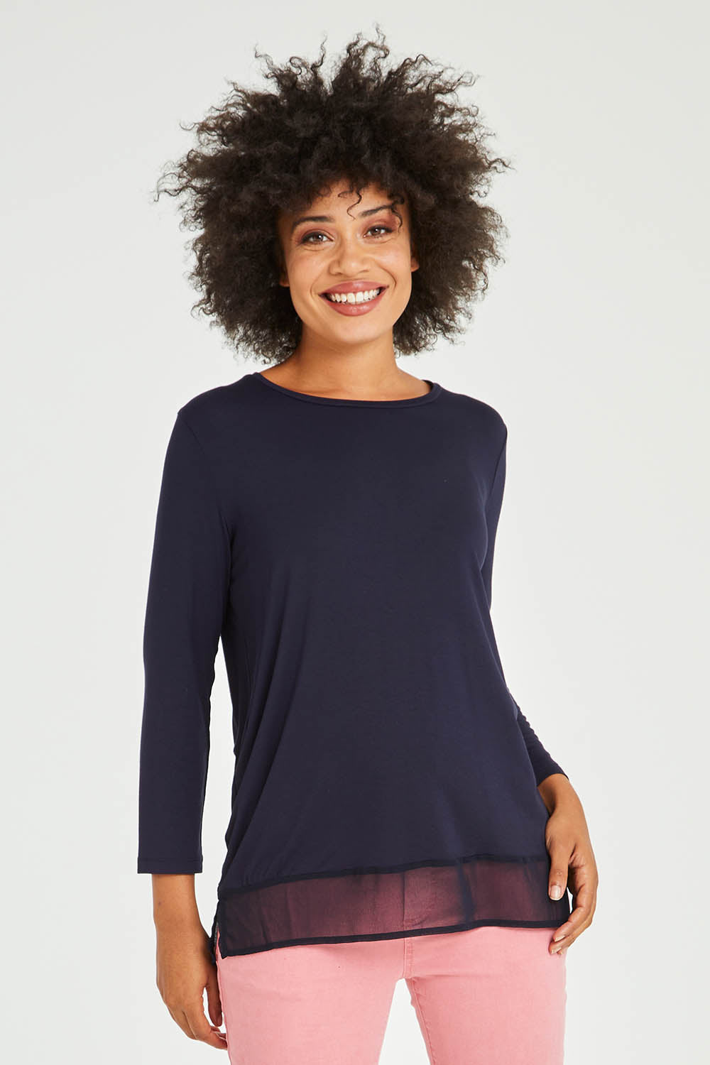 Model Olivia wearing size S of the L/S Georgette Hem Top in colour Navy (Blue), from the front, cropped image
