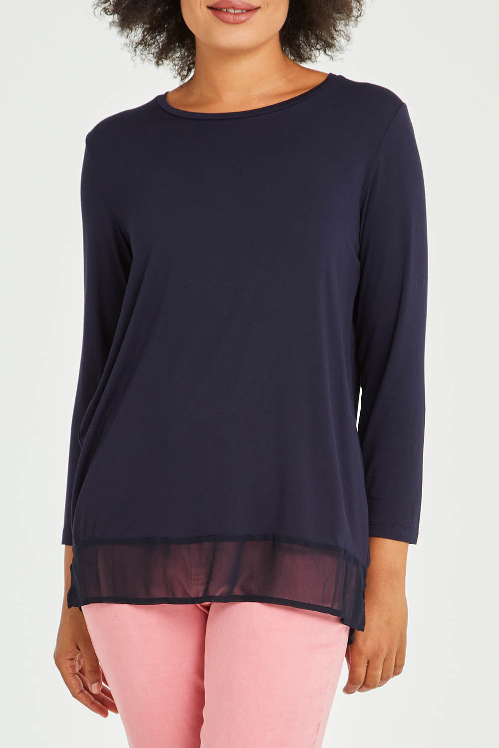 Model Olivia wearing size S of the L/S Georgette Hem Top in colour Navy (Blue), from the front, cropped image