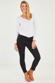 Model Kelly wearing size S of the Pull On Ripped Jeans in colour Black (Black), from the front, showing the whole outfit